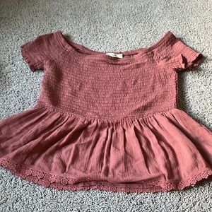 A blouse with off the shoulder and flows bottom